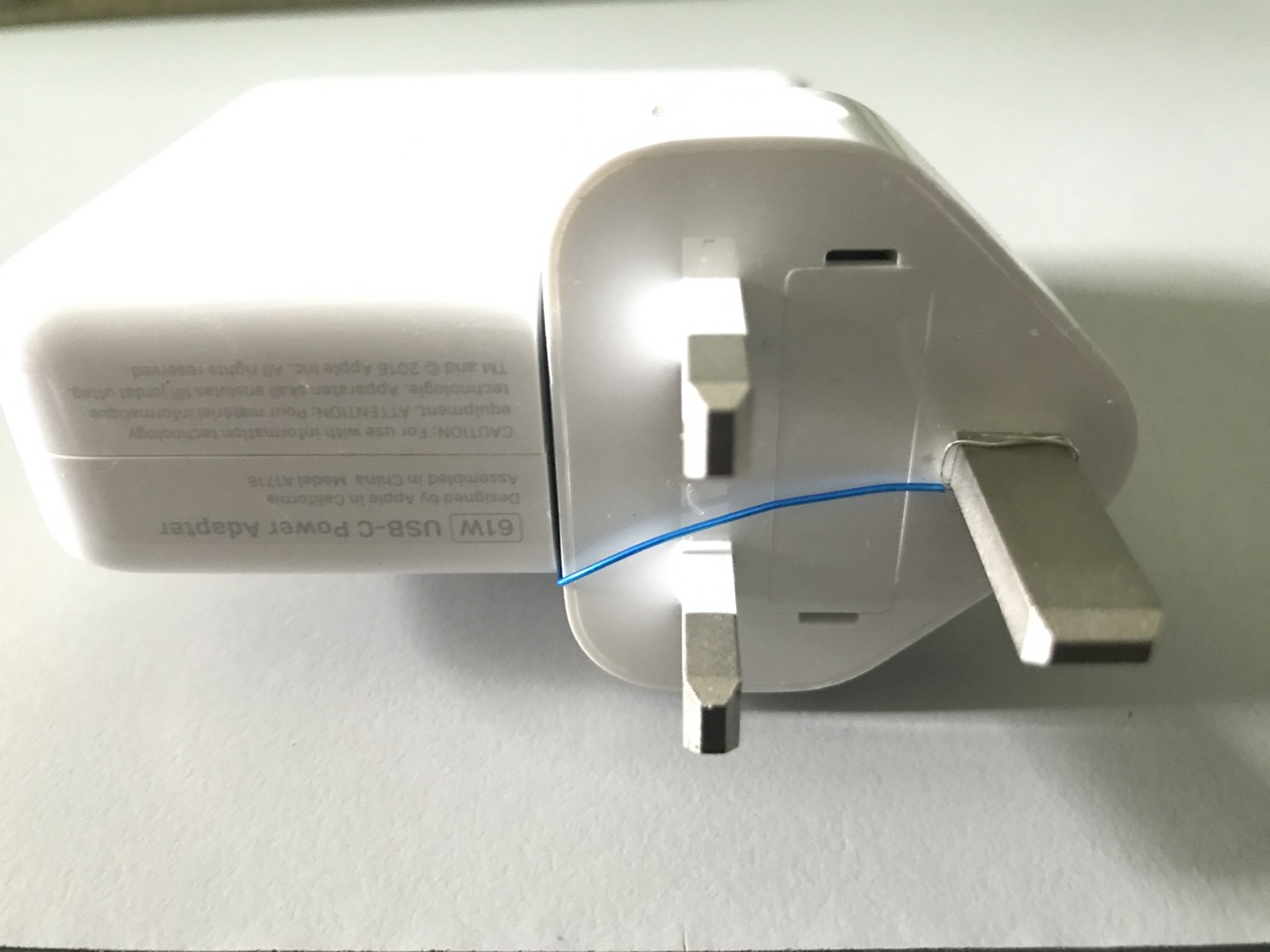 Plug inserted into power adapter